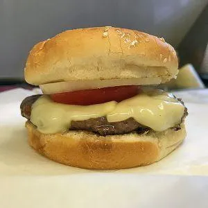 Cheeseburger with tomato and onion
